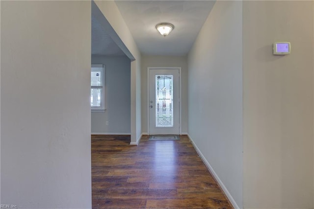 3096 Kenelm Dr, Chesapeake, VA 23323 - doorway with dark wood-type flooring and baseboards