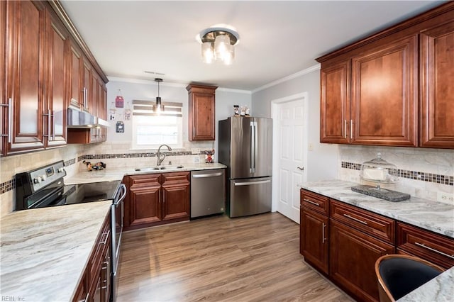 2617 Killey Ct, Virginia Beach, VA 23453 - kitchen with appliances with stainless steel finishes, a sink, under cabinet range hood, tasteful backsplash, and crown molding