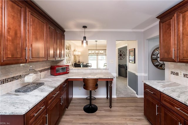 2617 Killey Ct, Virginia Beach, VA 23453 - kitchen with decorative backsplash, light wood finished floors, light stone counters, and ornamental molding
