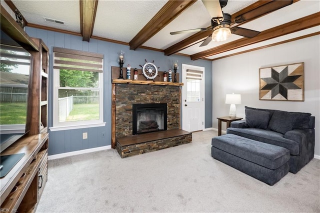2617 Killey Ct, Virginia Beach, VA 23453 - living area with beam ceiling, carpet floors, a ceiling fan, a stone fireplace, and a textured ceiling