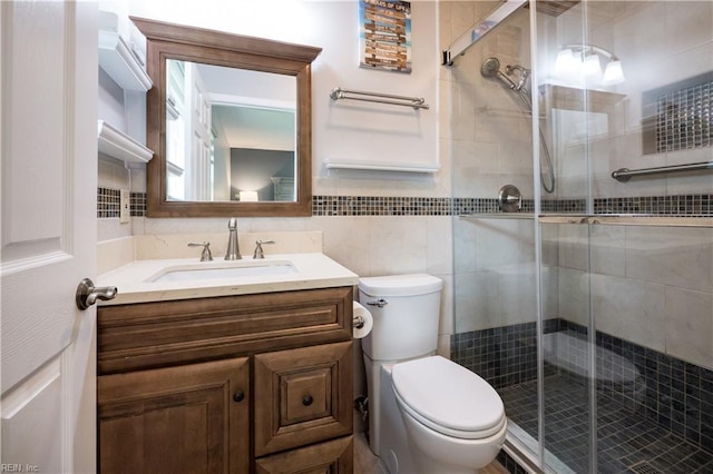2617 Killey Ct, Virginia Beach, VA 23453 - bathroom with toilet, vanity, a shower stall, and tile walls