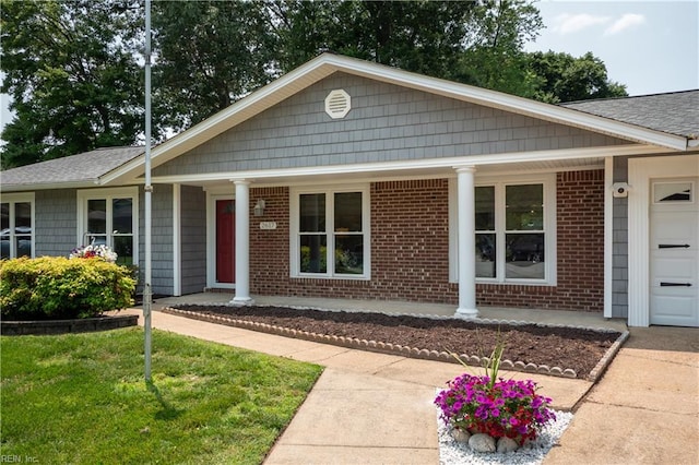 2617 Killey Ct, Virginia Beach, VA 23453 - ranch-style house featuring covered porch, an attached garage, brick siding, a shingled roof, and concrete driveway