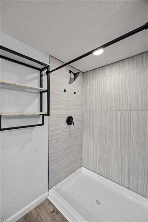 1305 Canary Dr, Virginia Beach, VA 23453 - full bath featuring tiled shower, baseboards, and wood finished floors