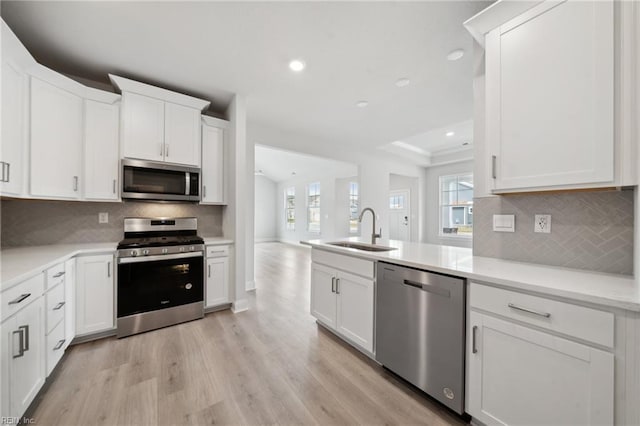 2142 Edwin Dr, Chesapeake, VA 23322 - kitchen with stainless steel appliances, a sink, healthy amount of natural light, recessed lighting, and light wood-style flooring