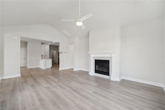 2142 Edwin Dr, Chesapeake, VA 23322 - unfurnished living room featuring a ceiling fan, a sink, light wood-type flooring, a fireplace, and high vaulted ceiling