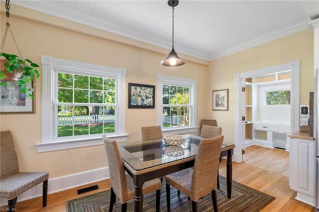 3321 Tyre Neck Rd, Chesapeake, VA 23321 - dining room featuring light wood-style flooring, ornamental molding, healthy amount of natural light, and baseboards