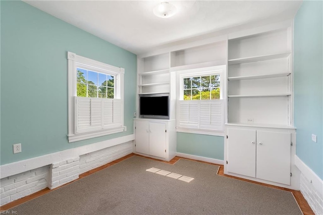 3321 Tyre Neck Rd, Chesapeake, VA 23321 - unfurnished living room featuring built in features and wood finished floors