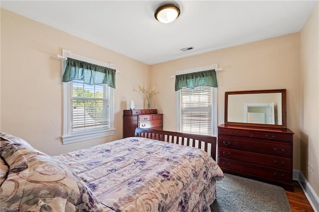3321 Tyre Neck Rd, Chesapeake, VA 23321 - bedroom featuring multiple windows, wood finished floors, and baseboards