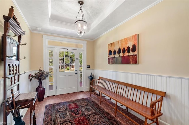 3321 Tyre Neck Rd, Chesapeake, VA 23321 - entryway featuring a chandelier, brick patterned flooring, a wainscoted wall, ornamental molding, and a tray ceiling