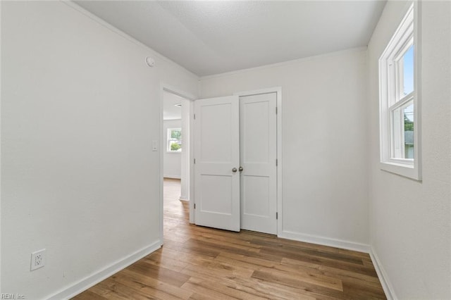 436 Smiley Rd, Hampton, VA 23663 - spare room featuring wood finished floors, baseboards, crown molding, and a smoke detector