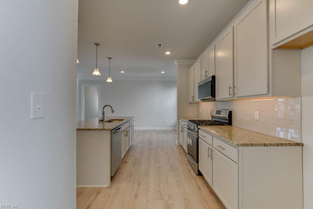 2246 Captiva Ln, Chesapeake, VA 23321 - kitchen with stainless steel appliances, a sink, light stone countertops, baseboards, and recessed lighting