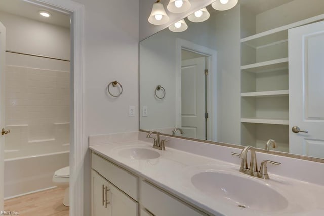 2246 Captiva Ln, Chesapeake, VA 23321 - full bath with double vanity, toilet, shower / bath combination, wood finished floors, and built in features