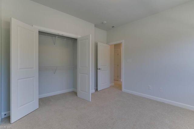 2246 Captiva Ln, Chesapeake, VA 23321 - unfurnished bedroom with light colored carpet, a closet, and baseboards