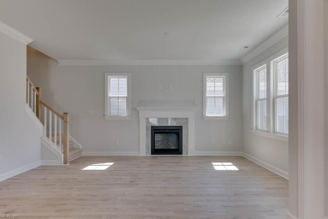 2246 Captiva Ln, Chesapeake, VA 23321 - unfurnished living room featuring crown molding, light wood-style floors, stairway, and baseboards