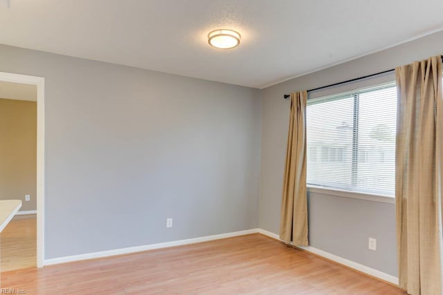 2922 Lyme Regis Quay Quay, Virginia Beach, VA 23452 - unfurnished room with plenty of natural light, light wood finished floors, and baseboards