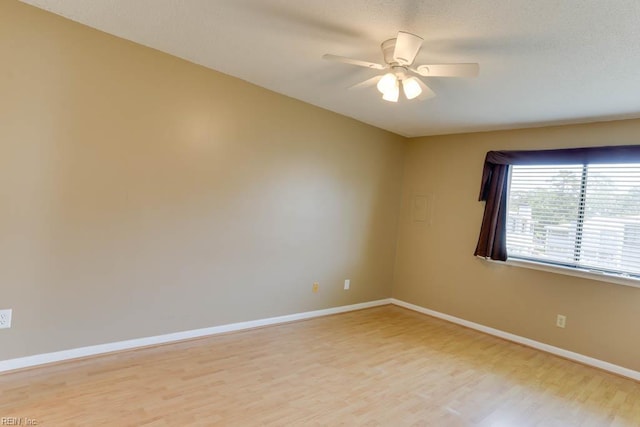 2922 Lyme Regis Quay Quay, Virginia Beach, VA 23452 - spare room with light wood-style flooring, ceiling fan, and baseboards