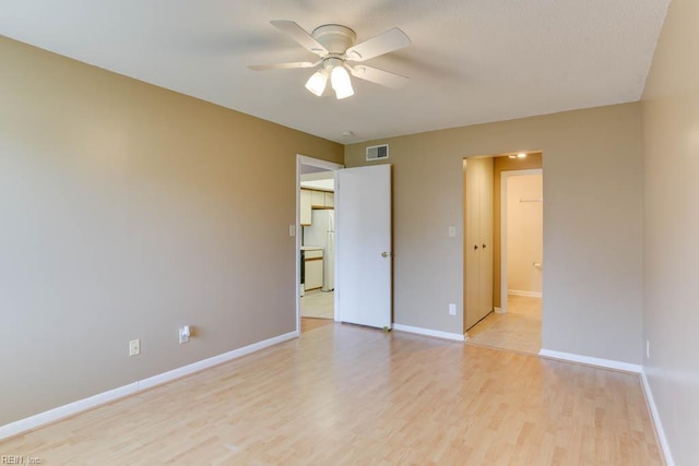 2922 Lyme Regis Quay Quay, Virginia Beach, VA 23452 - unfurnished bedroom with freestanding refrigerator, light wood-style flooring, baseboards, and ceiling fan