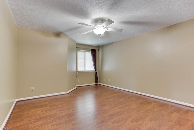 2922 Lyme Regis Quay Quay, Virginia Beach, VA 23452 - empty room with ceiling fan, wood finished floors, a textured ceiling, and baseboards