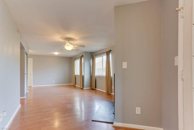 2922 Lyme Regis Quay Quay, Virginia Beach, VA 23452 - unfurnished room featuring ceiling fan, light wood-type flooring, baseboards, and a textured ceiling