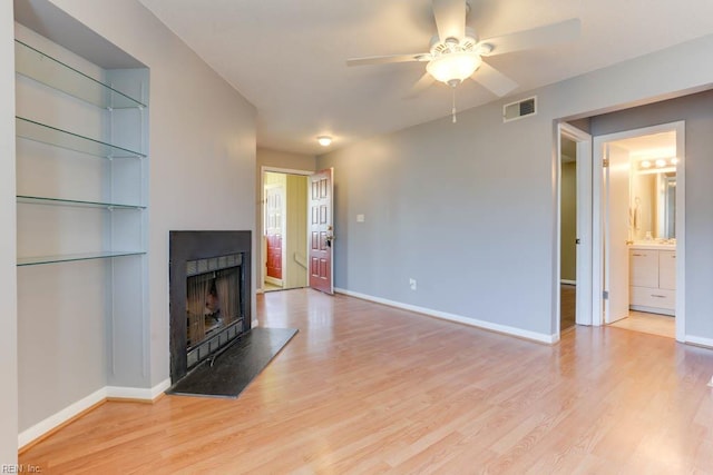 2922 Lyme Regis Quay Quay, Virginia Beach, VA 23452 - unfurnished living room featuring light wood finished floors, ceiling fan, and a fireplace with raised hearth