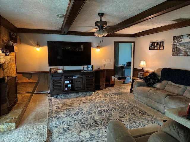 412 Joseph Topping Dr, Poquoson, VA 23662 - living area featuring a textured ceiling, beam ceiling, ceiling fan, wainscoting, and wood finished floors