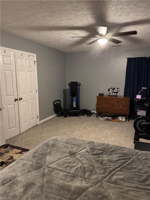 412 Joseph Topping Dr, Poquoson, VA 23662 - bedroom featuring carpet flooring, a ceiling fan, and a textured ceiling