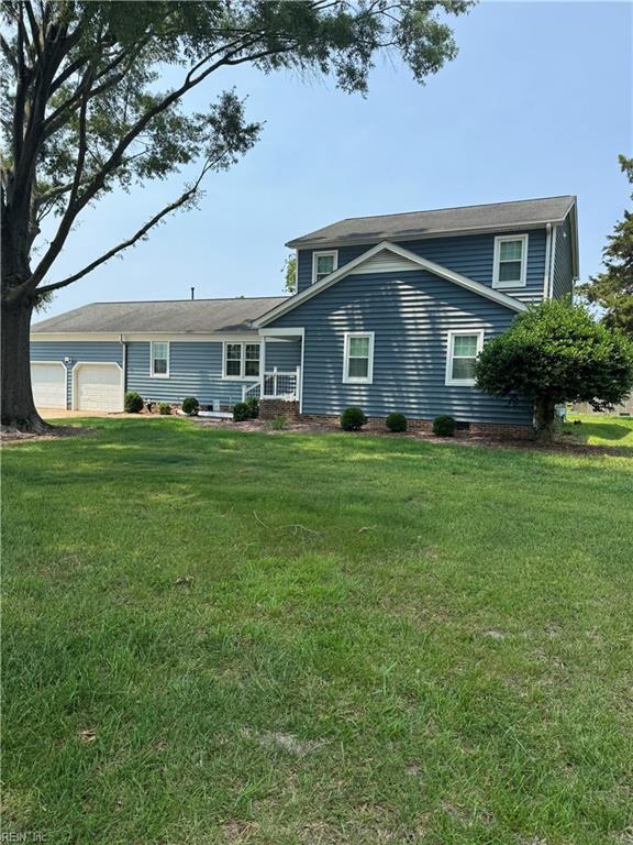 412 Joseph Topping Dr, Poquoson, VA 23662 - rear view of property featuring a yard