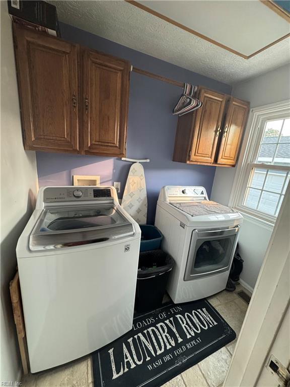 412 Joseph Topping Dr, Poquoson, VA 23662 - washroom with cabinet space, independent washer and dryer, a textured ceiling, and attic access