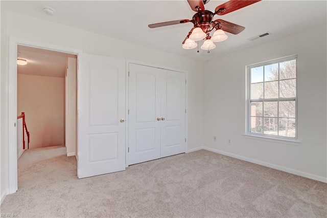 735 Great Marsh Ave, Chesapeake, VA 23320 - unfurnished bedroom featuring light carpet, baseboards, a closet, and ceiling fan
