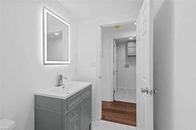 1304 Quash St, Hampton, VA 23669 - bathroom with vanity, marble finish floors, and toilet