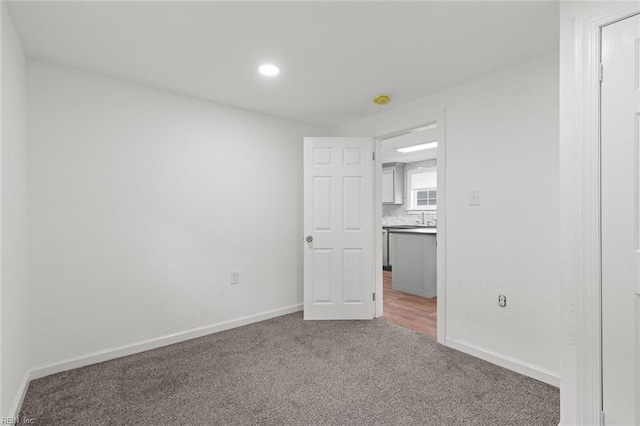 1304 Quash St, Hampton, VA 23669 - carpeted spare room featuring baseboards, recessed lighting, and a sink