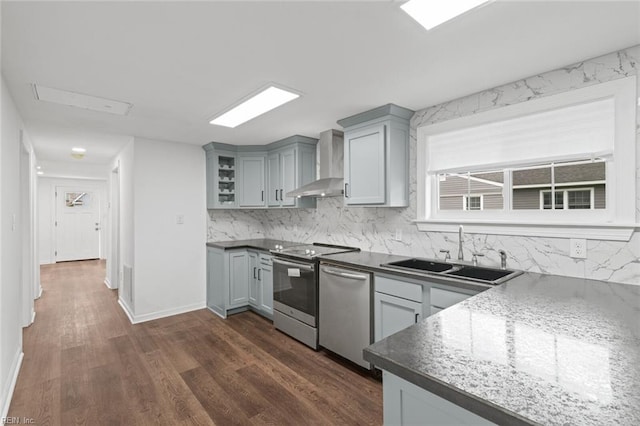 1304 Quash St, Hampton, VA 23669 - kitchen featuring wall chimney range hood, a sink, appliances with stainless steel finishes, gray cabinets, and decorative backsplash