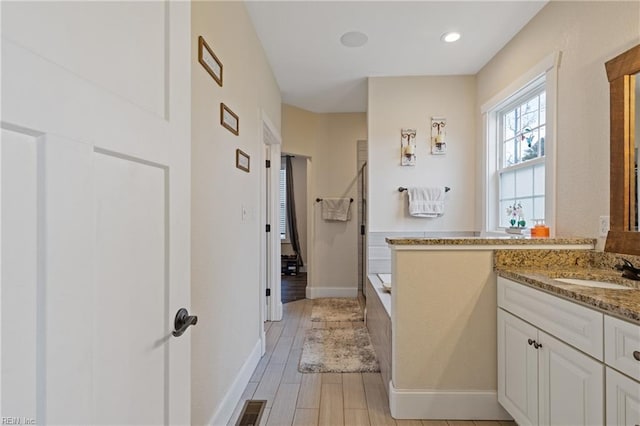 115 Cooks Landing Rd, Camden, NC 27921 - full bathroom featuring vanity, baseboards, wood finished floors, and recessed lighting