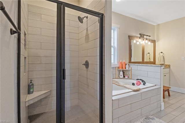 115 Cooks Landing Rd, Camden, NC 27921 - full bath with a stall shower, a garden tub, vanity, and baseboards