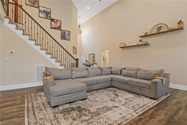 115 Cooks Landing Rd, Camden, NC 27921 - living room with baseboards, wood finished floors, stairway, crown molding, and a towering ceiling