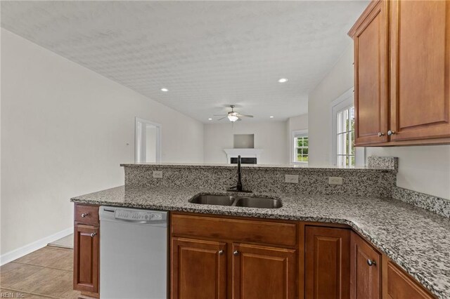 3353 Star Creek Ct, Suffolk, VA 23435 - kitchen with dishwasher, a sink, a ceiling fan, light stone counters, and baseboards
