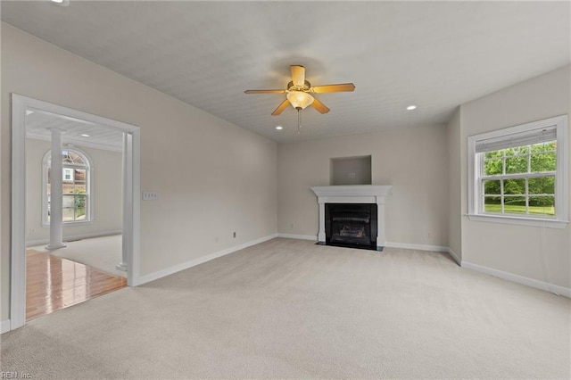 3353 Star Creek Ct, Suffolk, VA 23435 - unfurnished living room with light colored carpet, plenty of natural light, baseboards, ceiling fan, and recessed lighting