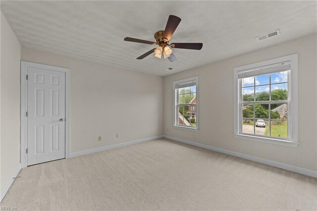 3353 Star Creek Ct, Suffolk, VA 23435 - unfurnished room with baseboards, light carpet, and ceiling fan