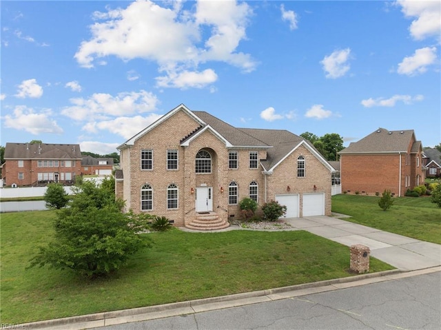 3353 Star Creek Ct, Suffolk, VA 23435 - view of front of house with driveway, a front lawn, and brick siding
