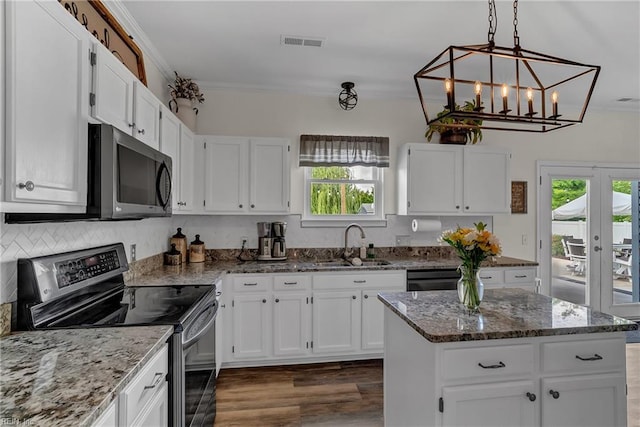 170 Eagle Creek Rd, Moyock, NC 27958 - kitchen featuring stainless steel range with electric cooktop, a sink, plenty of natural light, and dark wood-type flooring