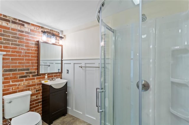 4901 Lake Shore Dr, Chesapeake, VA 23321 - bathroom with a shower stall, vanity, toilet, and brick wall