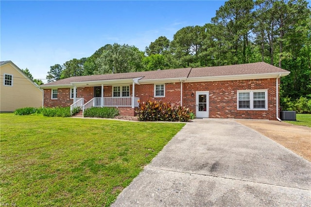 4901 Lake Shore Dr, Chesapeake, VA 23321 - ranch-style home featuring covered porch, concrete driveway, a front lawn, and brick siding