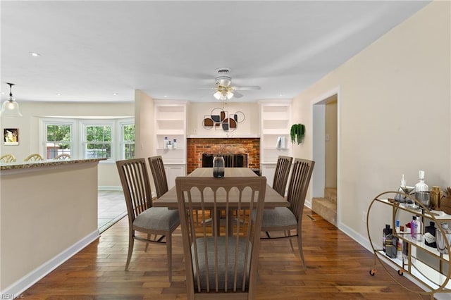 4901 Lake Shore Dr, Chesapeake, VA 23321 - dining space featuring a ceiling fan, dark wood finished floors, a brick fireplace, baseboards, and recessed lighting