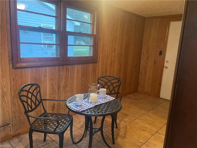 203 Windsor Ave, Smithfield, VA 23430 - dining area with wood walls and light tile patterned floors