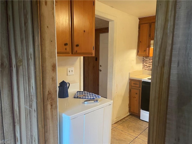 203 Windsor Ave, Smithfield, VA 23430 - washroom featuring light tile patterned floors and washer / dryer