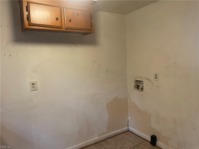 203 Windsor Ave, Smithfield, VA 23430 - washroom featuring cabinet space, hookup for a washing machine, light tile patterned floors, and baseboards