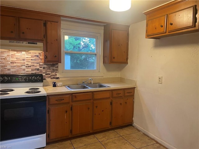 203 Windsor Ave, Smithfield, VA 23430 - kitchen with range with electric cooktop, under cabinet range hood, a sink, and light countertops