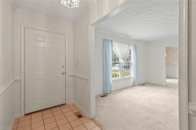 1118 Patrick Ln, Newport News, VA 23608 - entrance foyer with a textured ceiling, crown molding, light tile patterned flooring, light colored carpet, and a chandelier