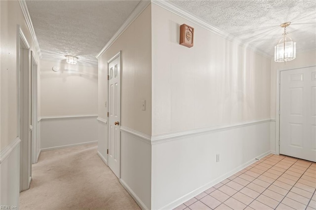 1118 Patrick Ln, Newport News, VA 23608 - hallway featuring a textured ceiling, crown molding, and light tile patterned floors