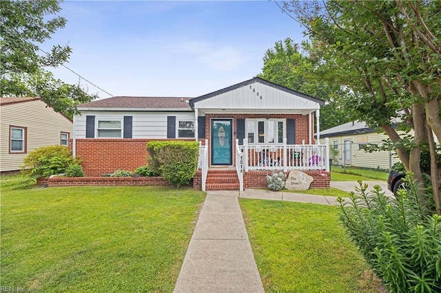 1014 Rowe St, Hampton, VA 23669 - bungalow-style home featuring brick siding, covered porch, and a front lawn